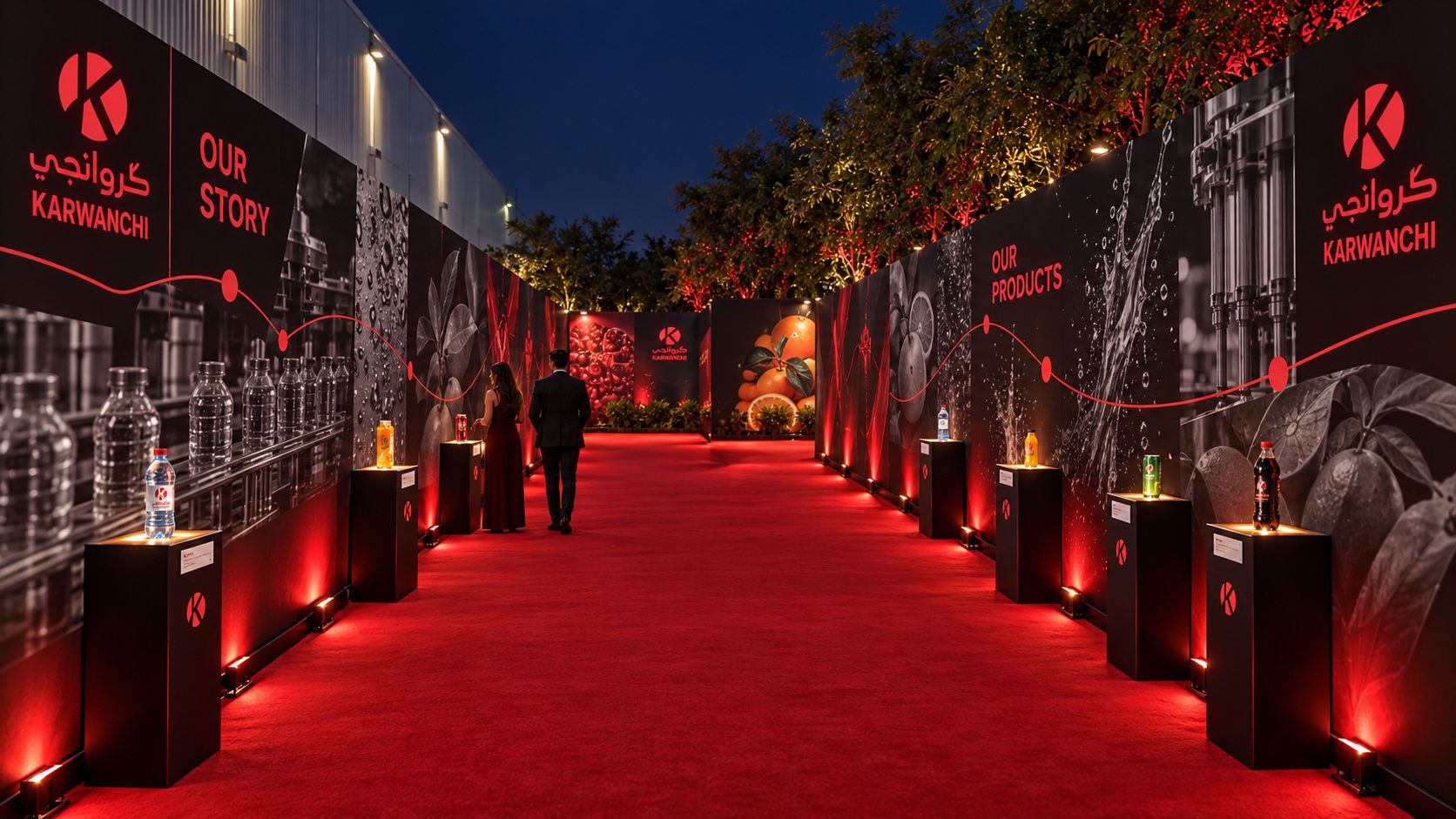 Corridor of heritage walls and lit product plinths on both sides of a red carpet