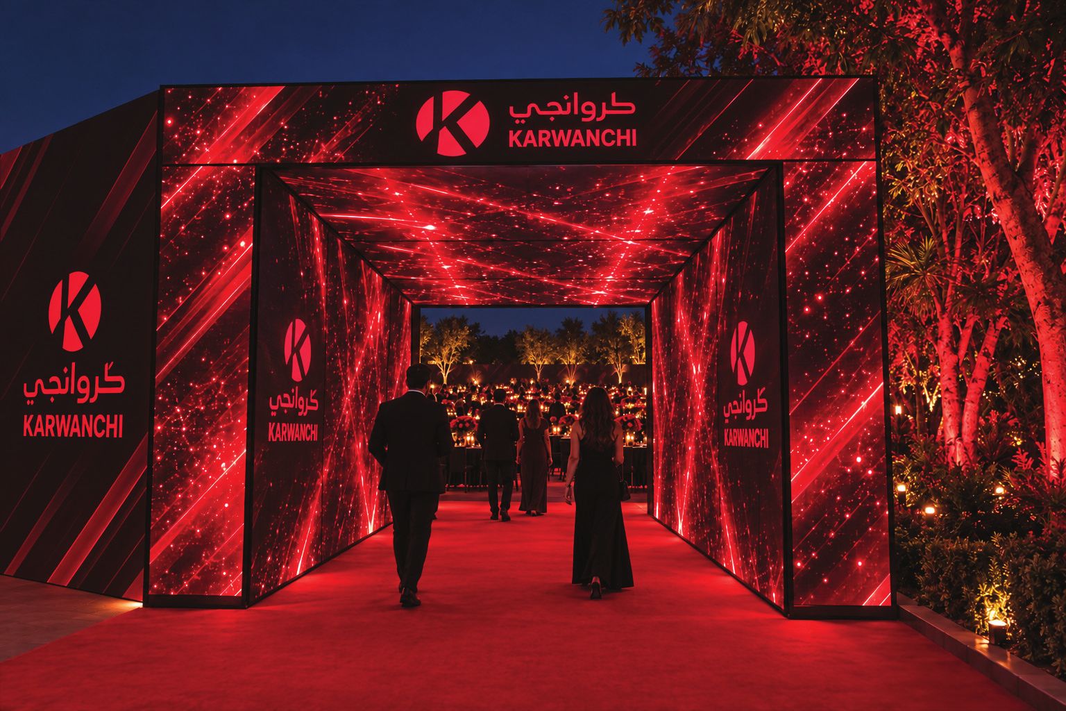Immersive LED tunnel with red light streaks leading into the celebration